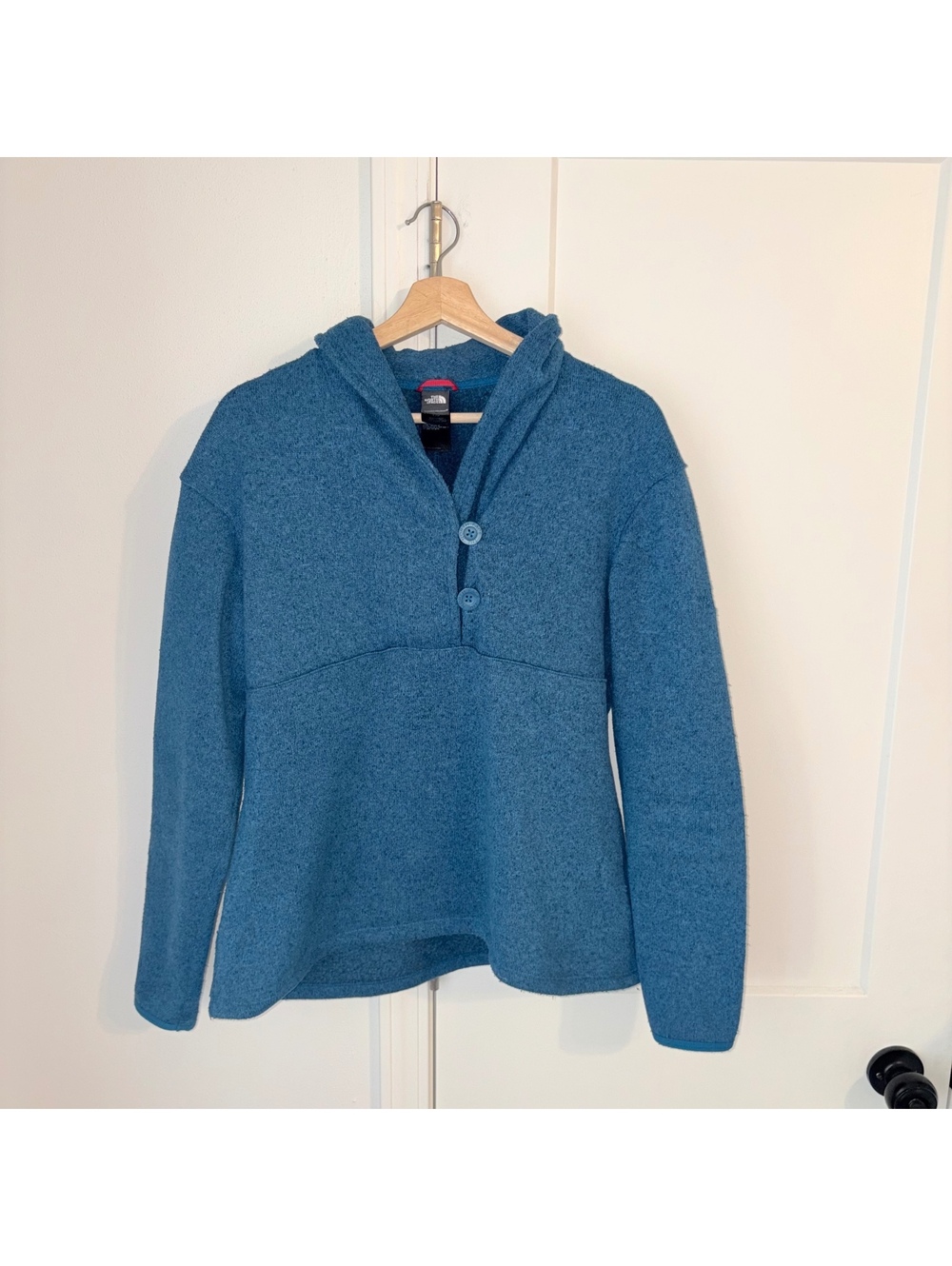 The North Face Woman’s L $125 blue hooded fleece pullover With Button Detail